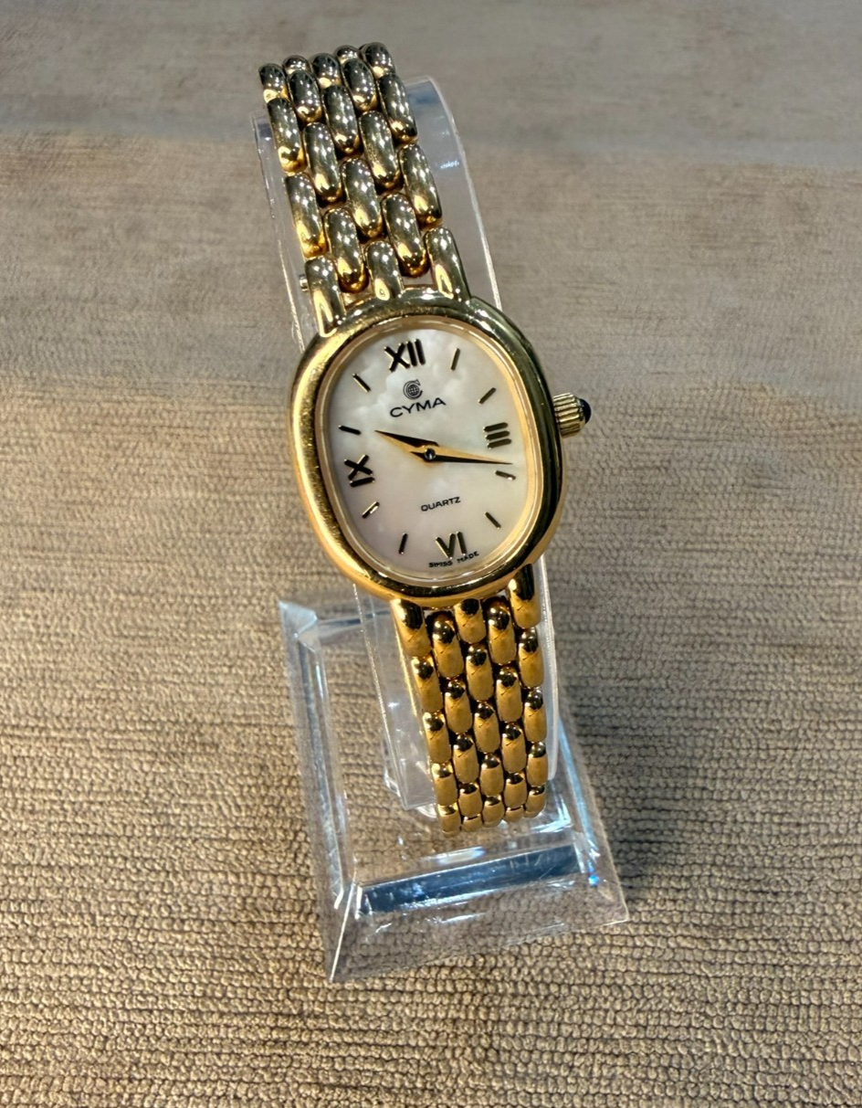 Cyma Swiss Ladies Gold Tone Oval Mother of Pearl Dial Quartz Watch Panel